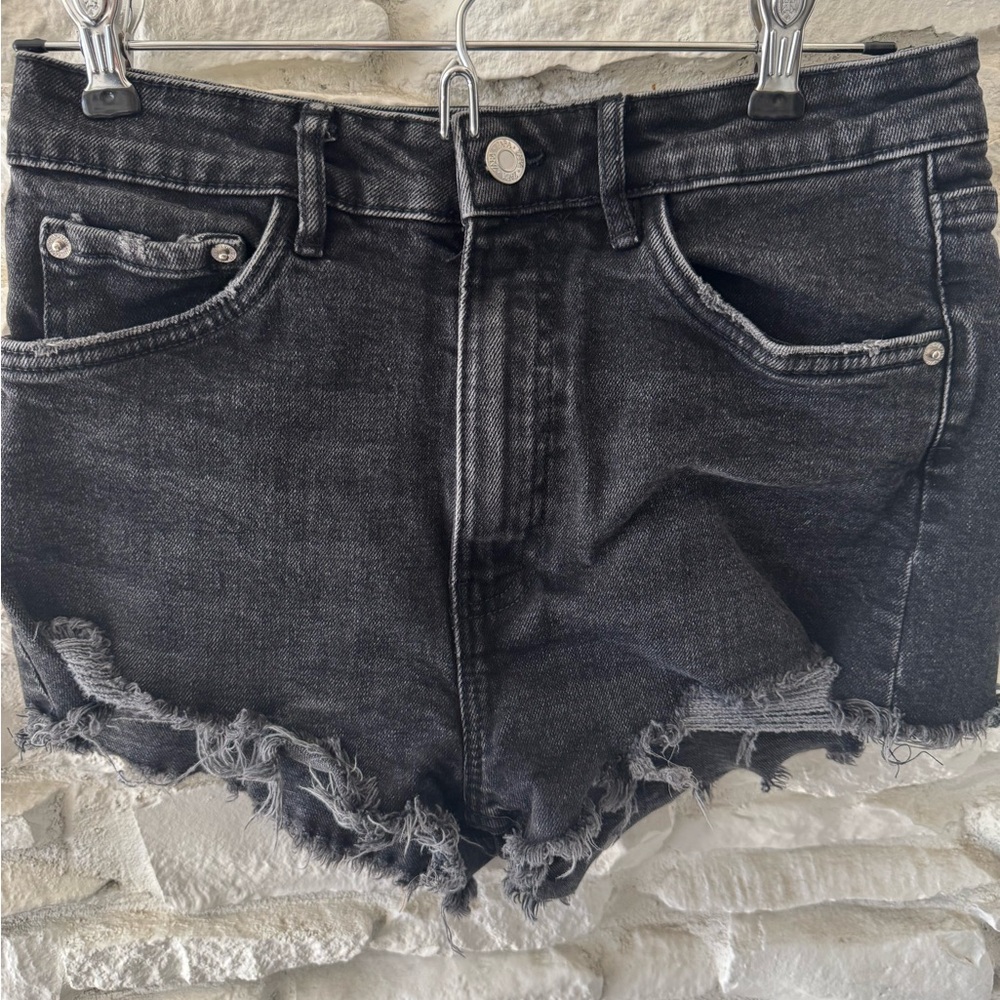 Zara black denim high-rise distressed shorts.